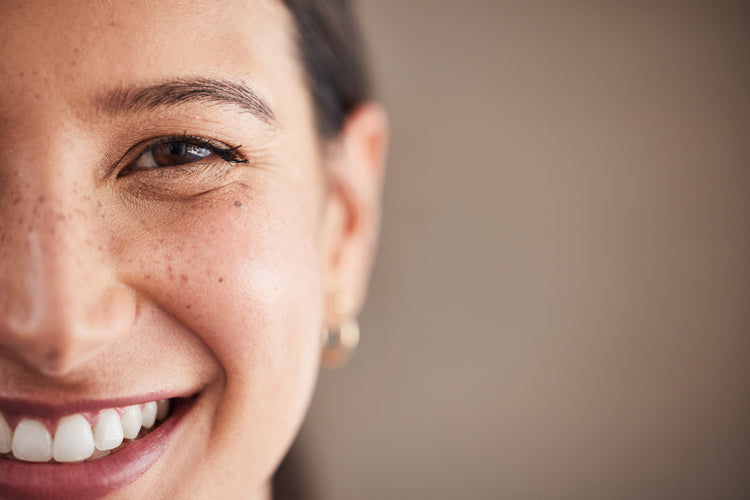 Close-up of woman smiling with white teeth, showing healthy smile and dental care.
